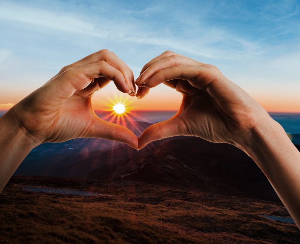 heart-shaped-hands-sunset